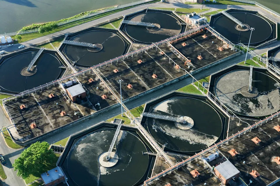 Aerial view of circular tanks at a wastewater treatment plant
