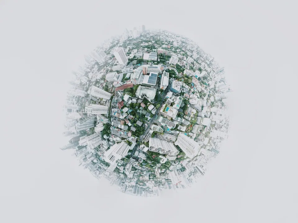 Miniature planet made of city buildings and trees