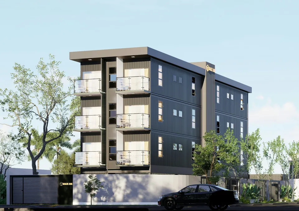 Modern dark gray apartment building with balconies