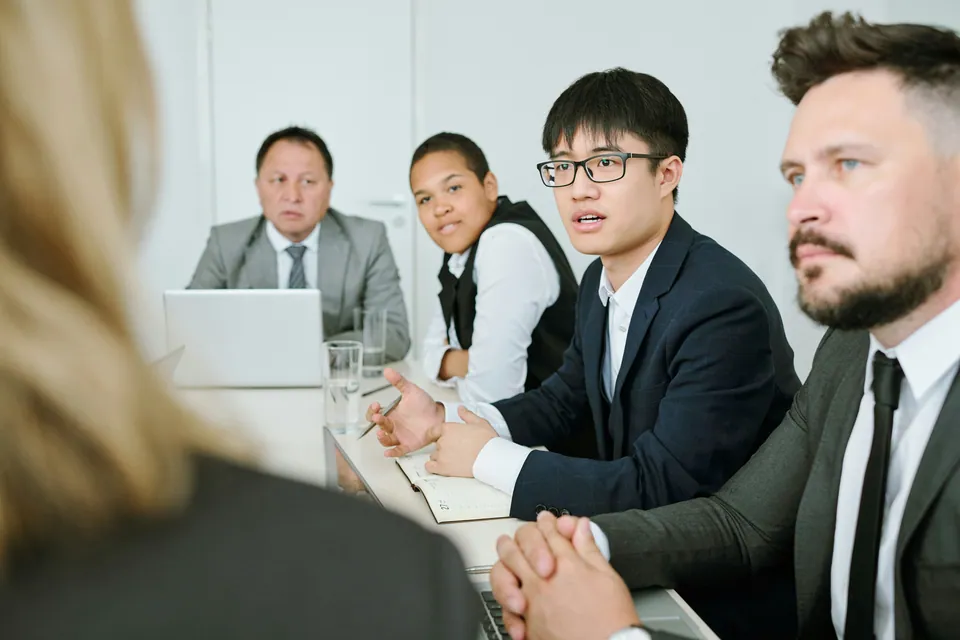 Business team listening attentively at a conference table