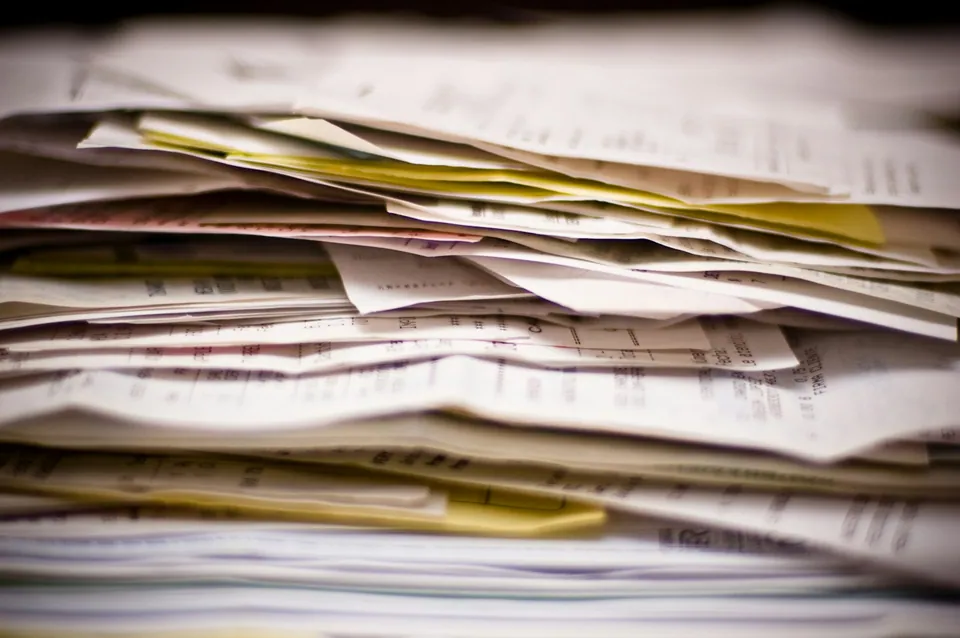 Messy stack of papers and documents