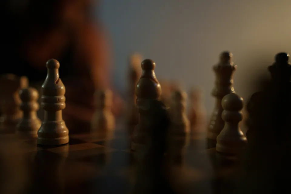 Close-up of wooden chess pieces on a board