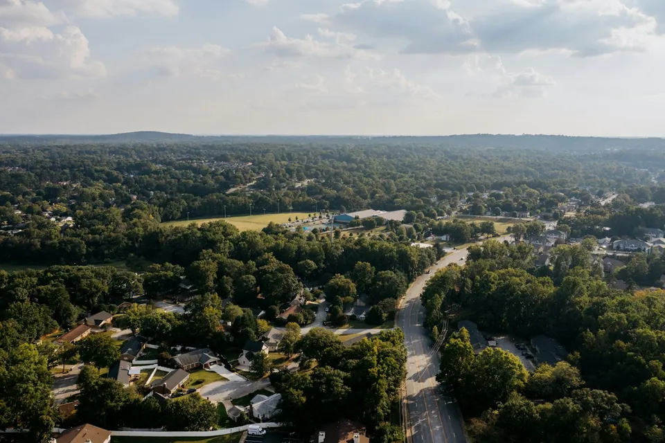 Aerial view of a wooded suburban neighborhood
