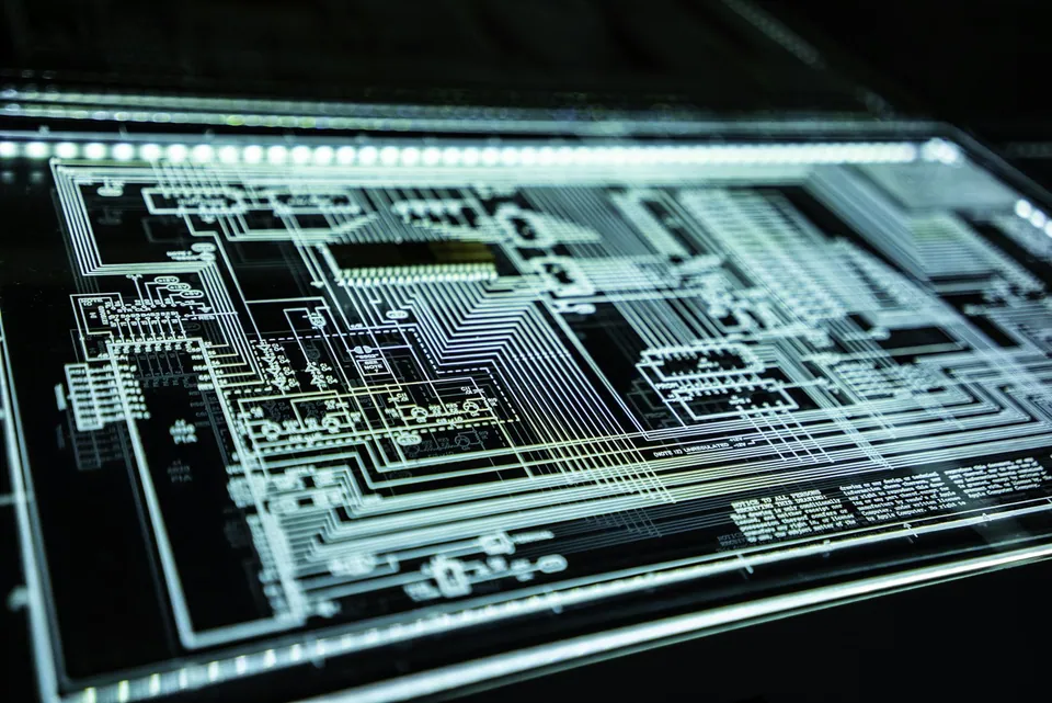 Glowing circuit board pattern on a dark screen