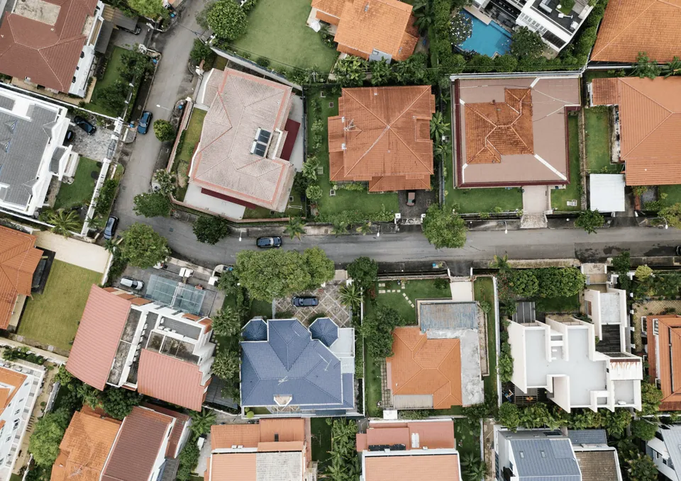 Aerial view of suburban houses with red tile roofs