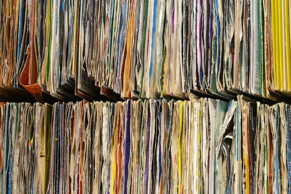 Shelves crammed with old paper file folders