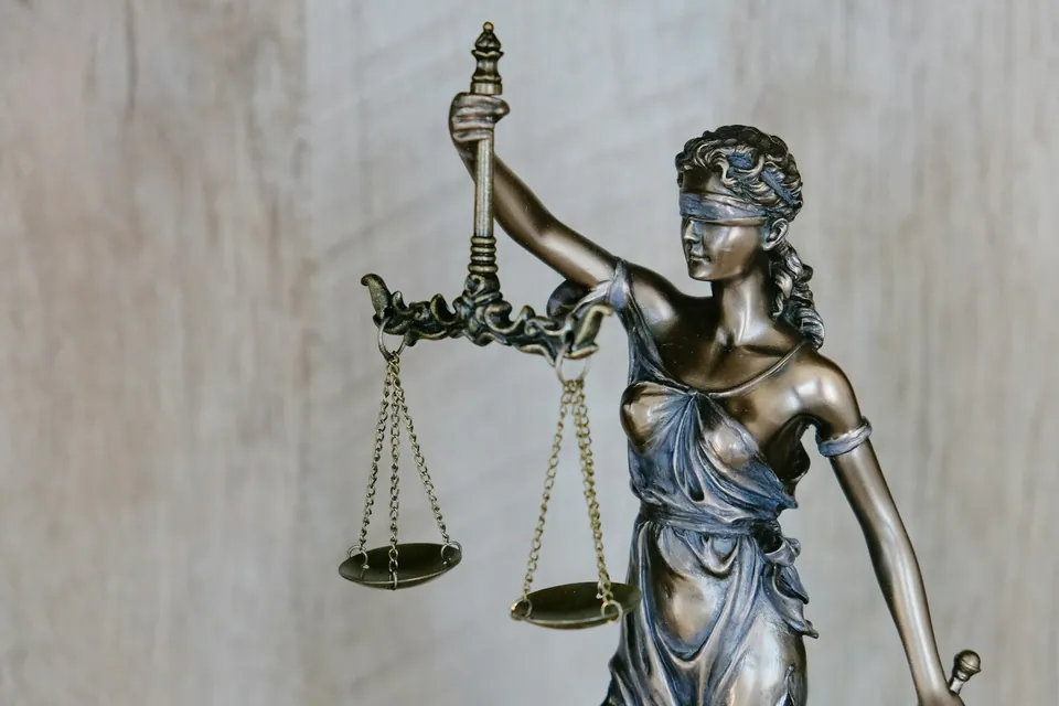 Bronze statue of Lady Justice holding scales