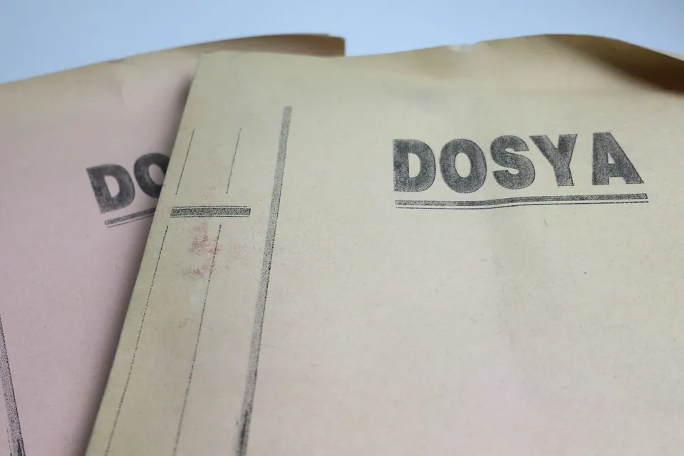 Close-up of manila file folders stamped DOSYA