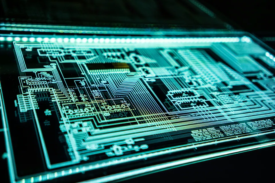 Glowing teal circuit board pattern on a dark screen