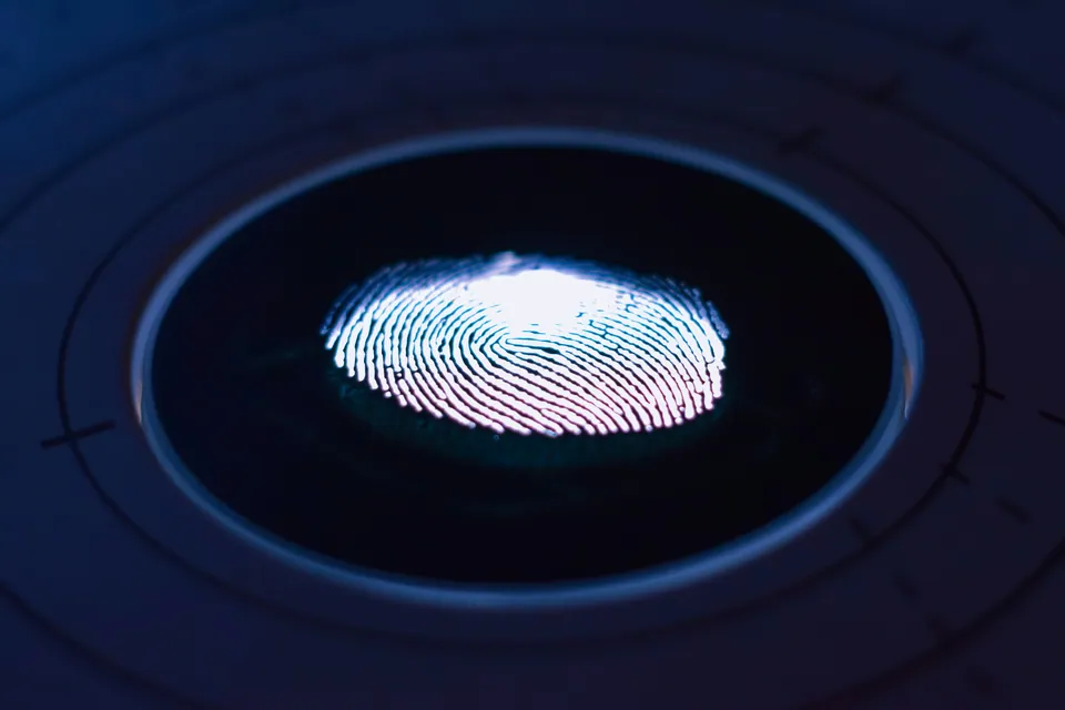 Glowing fingerprint scan on a dark sensor